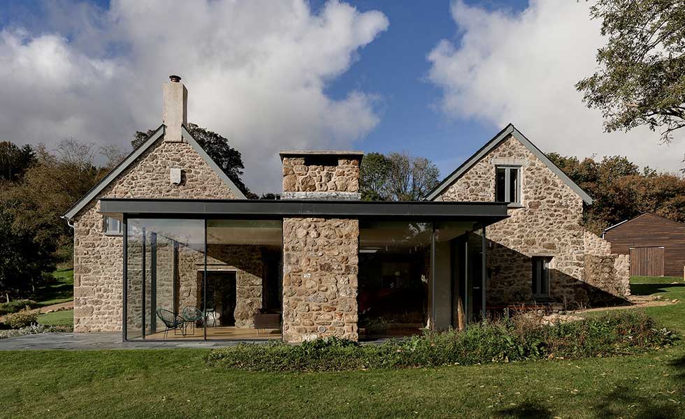 glass extension attached to original seventeenth century farmhouse