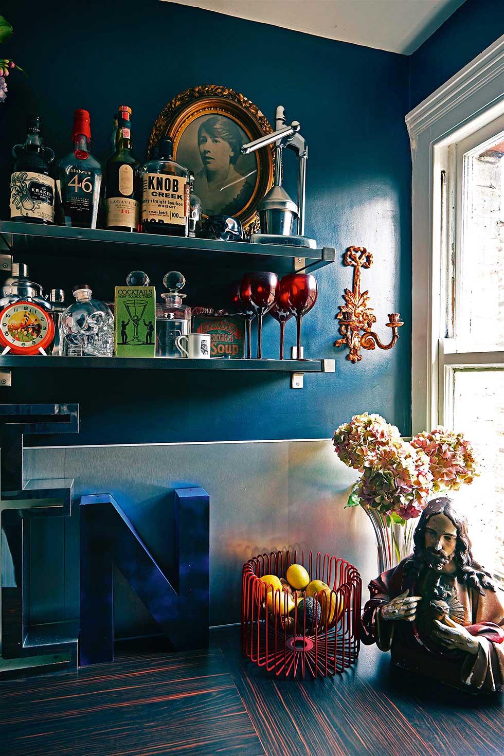 Duplex apartment kitchen shelves and bottles