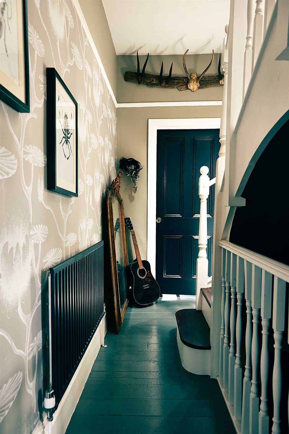 Duplex apartment floral wallpaper in hallway