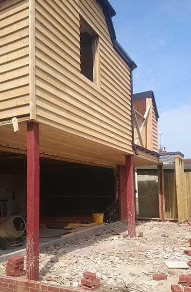 cedar cladding on a extension on stilts