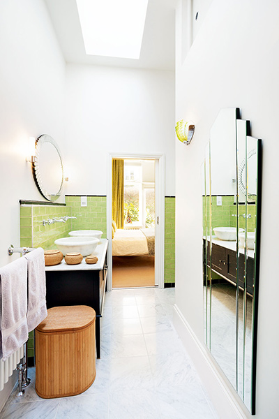 en-suite bathroom with honed marble sinks in a Victorian home
