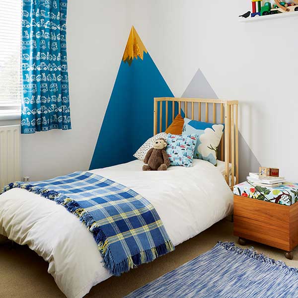 children bedroom with geometric shapes painted on wall