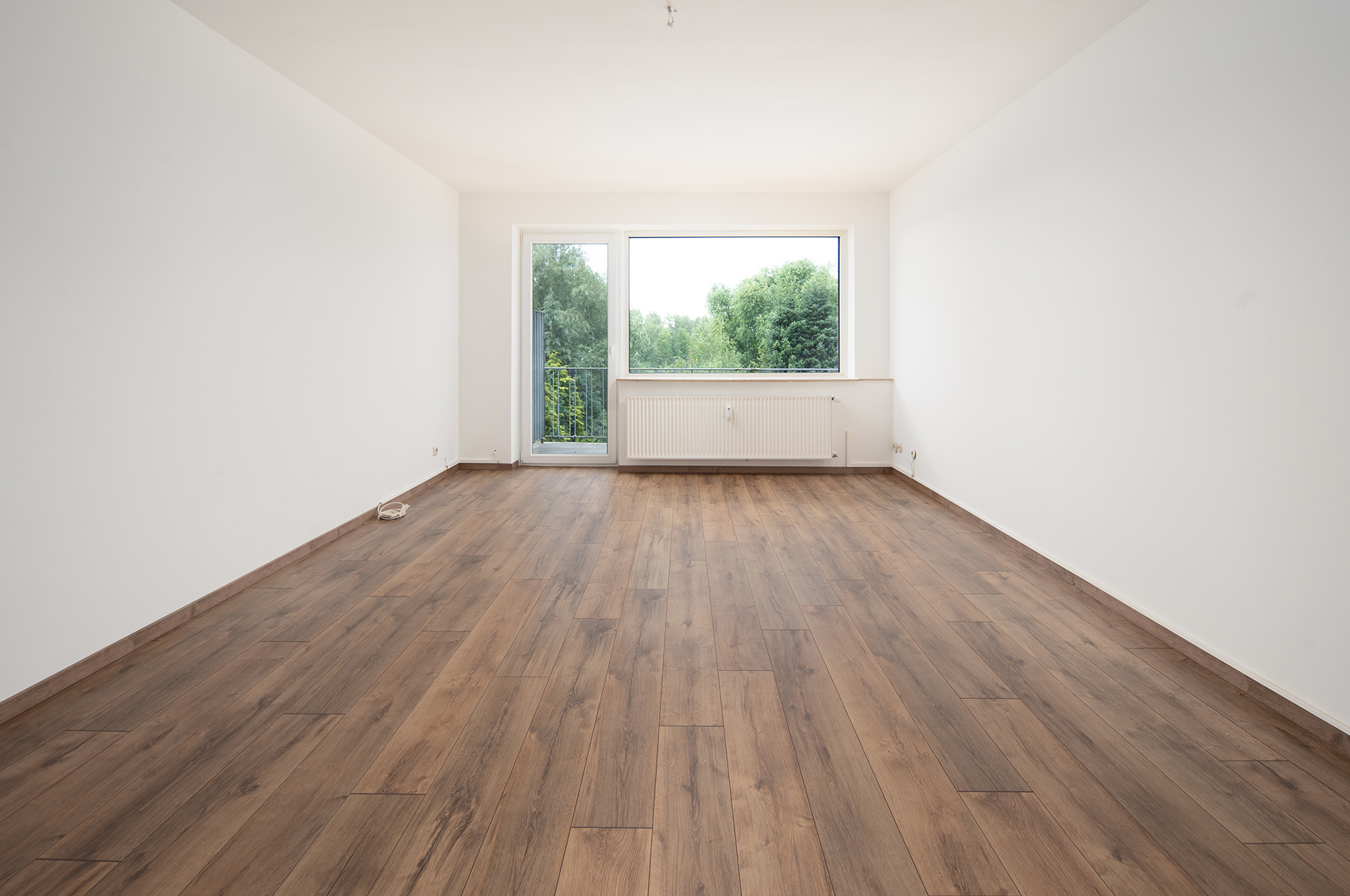 11-Parteienhaus mit 6 Garagen in Bremen Burgdamm — Wohnzimmer WE EG