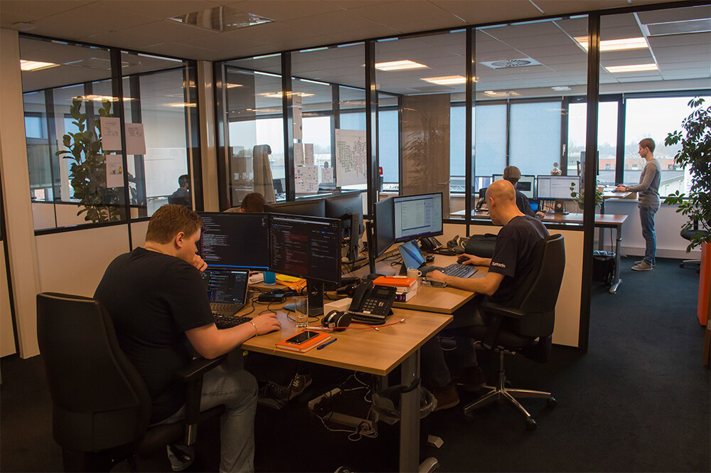 Developers covadis achter beeldscherm Developers covadis achter beeldscherm