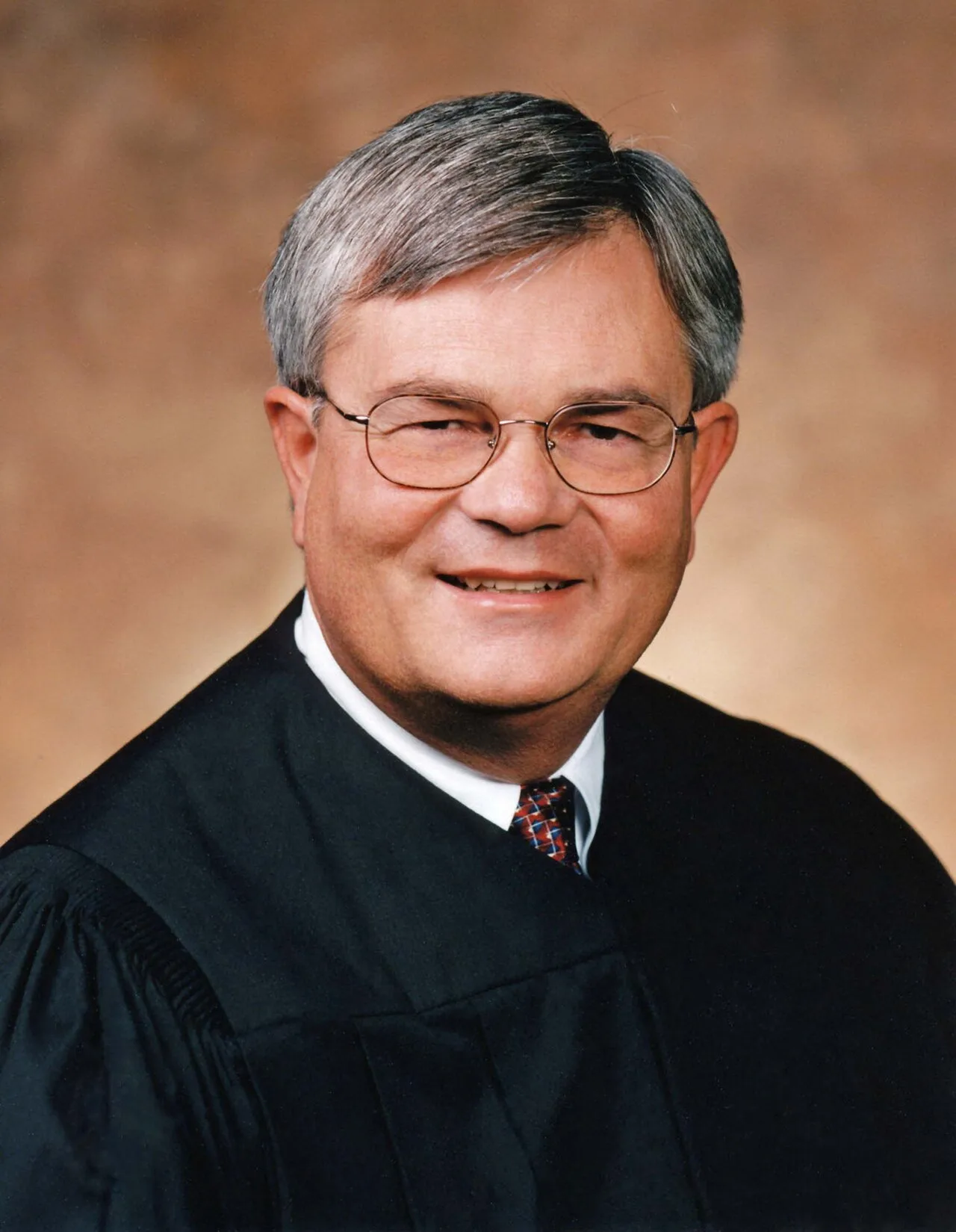 Portrait of William J. Riley (1947–2023) – memorial page