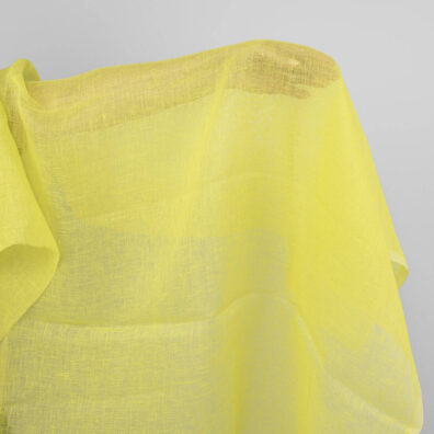 Geltonas peršviečiamas lino audinys