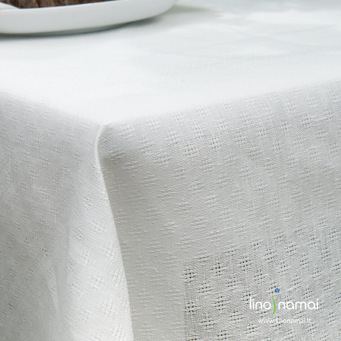 Lininis pieno baltumo staltiesės audinys austas kiauraraščiu