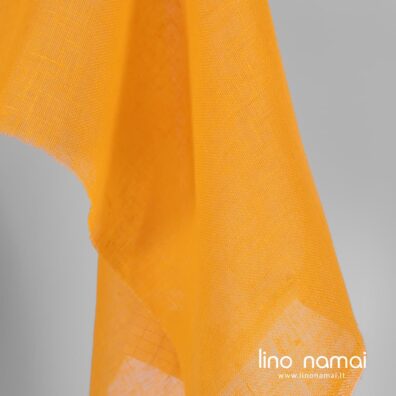 Lininis audinys geltonas su oranžiniu atspalviu permatomas