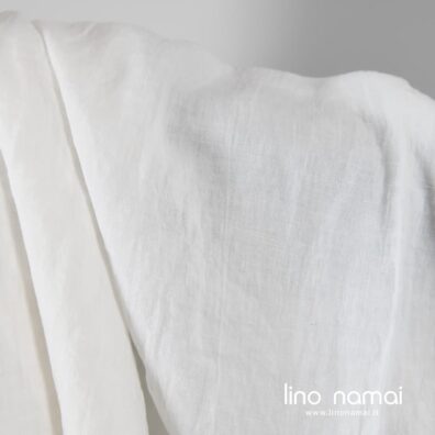 Lininis audinys pieno baltumo skalbtas minkštas švelnus nelygios struktūros