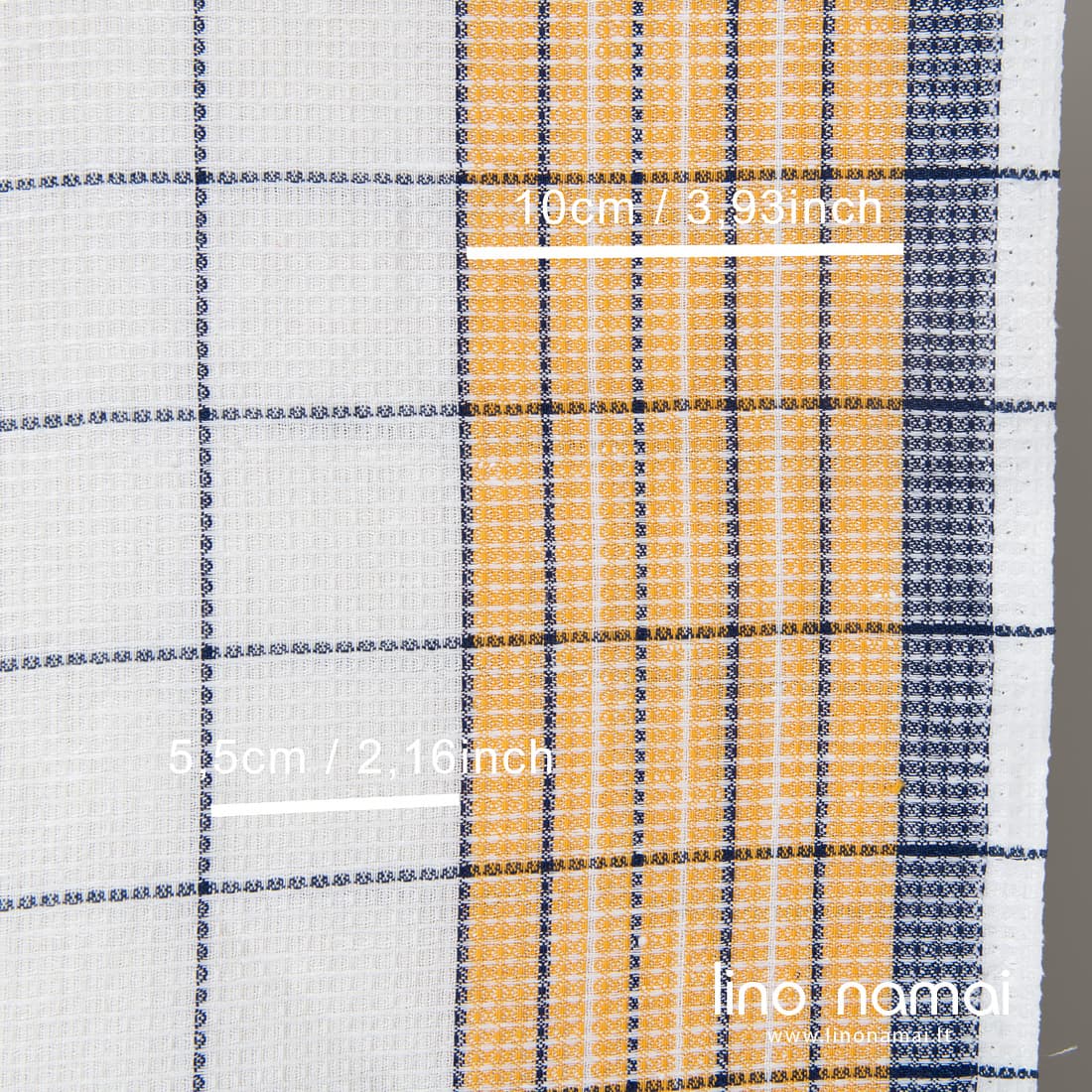 Lino - medvilnės rankšluostinis ryškiai baltas „vaflinis“ audinys geltonais ir mėlynais langeliais