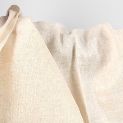 Gelsvai baltas audinys su aukso blizgesiu