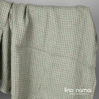 Lininis pilkas audinys žaliais langeliais, skalbtas