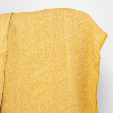 Lininis geltonas raštuotas audinys, skalbtas.
