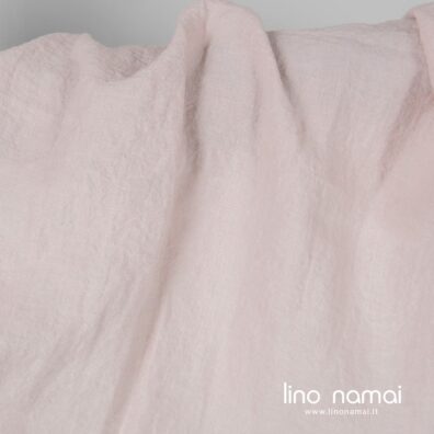 Minkštas švelnus skalbtas šviesiai rožinis lininis audinys