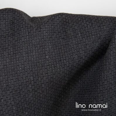 Lininis pilkai juodas audinys smulkiu raštu