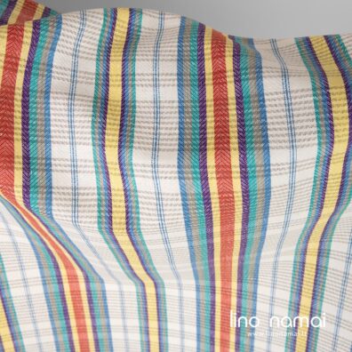 Lino - medvilnės audinys dryžuotas, išaustas iš ryškiai baltų, mėlynų, žalsvai pilkų, žalių, violetinių, geltonų, raudonų ir natūralios spalvos (rusvai pilkų, nedažytų) verpalų