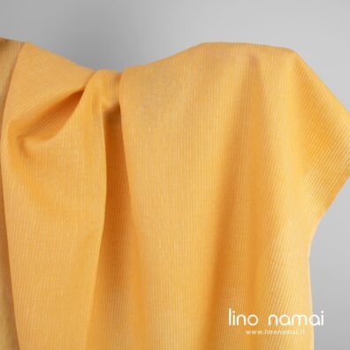 Lininis audinys geltonas ažūriniais dryžiais