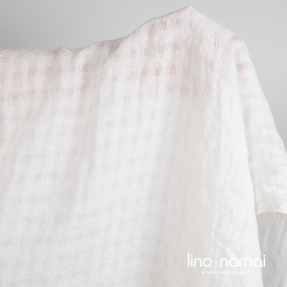 Lininis audinys permatomais langeliais baltas skalbtas tinka lengviems drabužiams ir namų tekstilei siūti