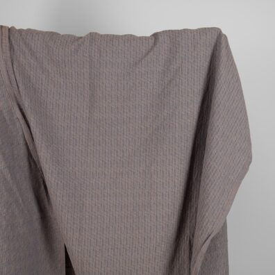 Puslininis audinys pilkai-rusvai raštuotas skalbtas