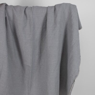 Puslininis audinys pilkas „žąsų kojelių“ raštu skalbtas