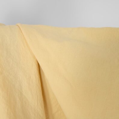 Puslininis audinys gelsvas skalbtas 145cm pločio