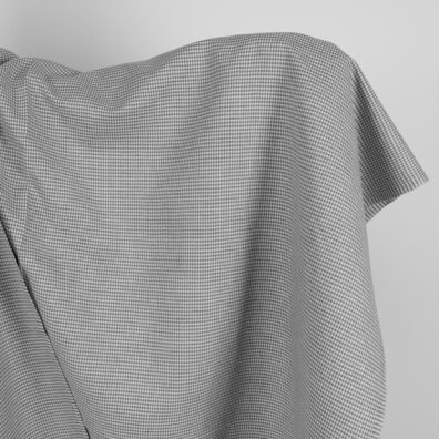 Puslininis audinys pilkas „žąsų kojelių“ raštu