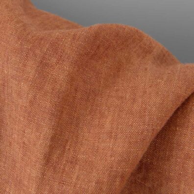 Lininis audinys raudonai rudas melanžinis skalbtas tinka drabužiams ir namų tekstilės gaminiams siūti