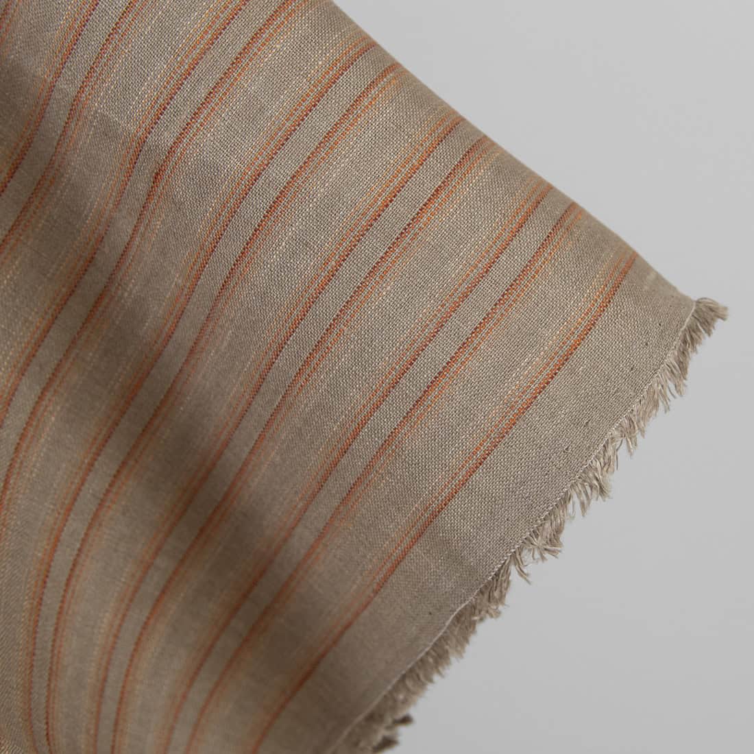 Lininis audinys oranžiniais ir rudais dryžiais 150cm pločio