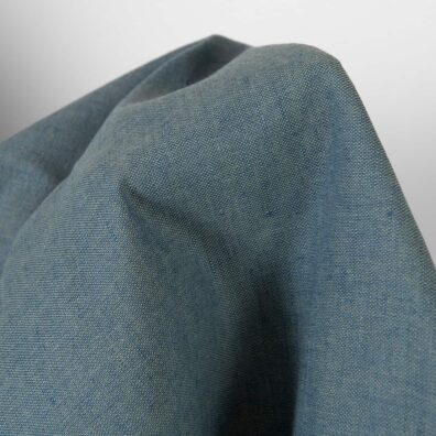 Puslininis audinys žalsvas-mėlynas melanžinis tinka drabužiams ir namų tekstilės gaminiams siūti