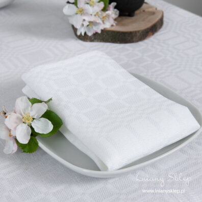 Śnieżnobiała lniana serwetka stołowa w kratkę