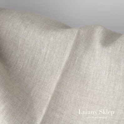 Niebarwiony len wytkany w melanżu z białą przędzą.