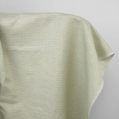 Jasnozielona tkanina falisty wzór