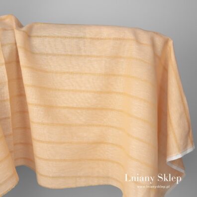 Żółta tkanina lniano - bawełniana w paski.