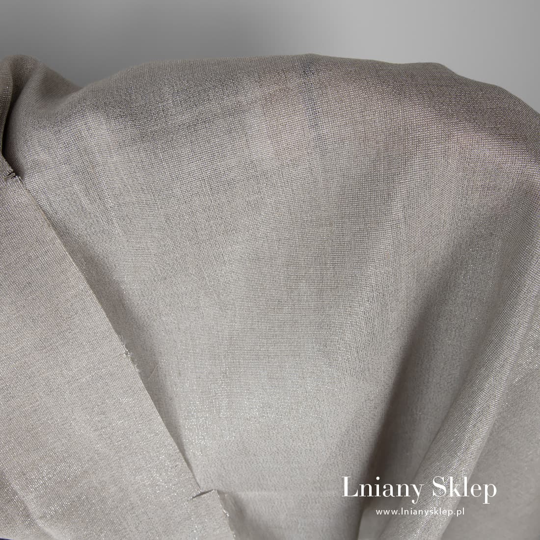 Tkanina z połyskiem z niebarwionego lnu i srebrzystego poliestru.