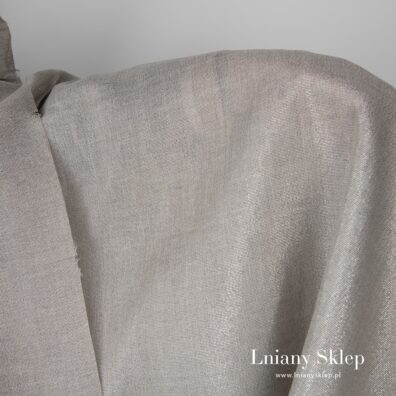 Szara tkanina z przędzy lnianej oraz lureksowej.
