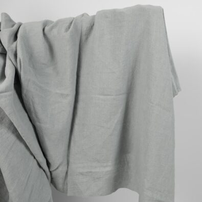 Lniana tkanina szara niebieskawa, szeroka, prana.