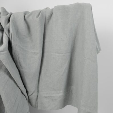 Lniana tkanina szara niebieskawa, szeroka, prana.