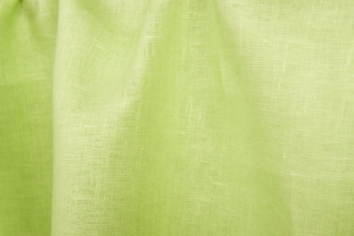 Jasnozielona tkanina lniana.