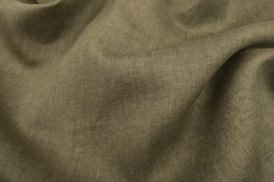 Melanżowa tkanina lniana ciepła zieleń.