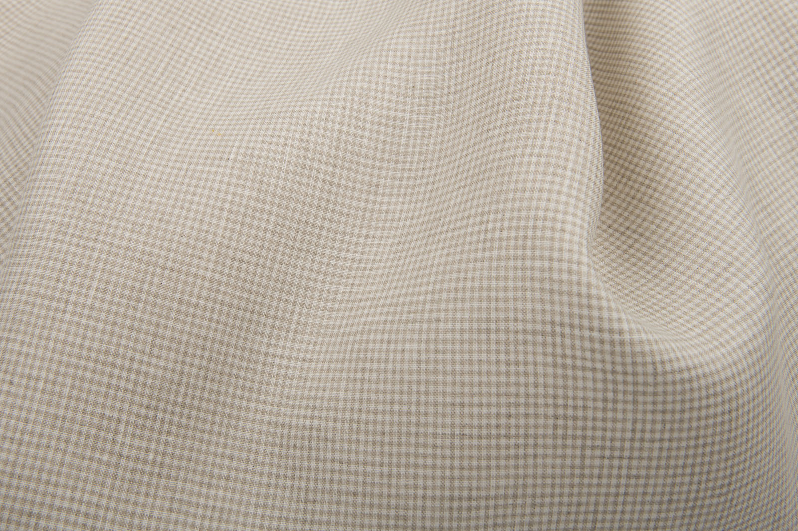 Tkanina lniana w drobną szarą krateczkę.