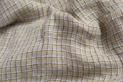 Prana tkanina lniana szara w żółtą kratkę.