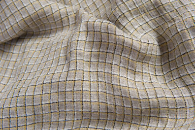 Prana tkanina lniana szara w żółtą kratkę.