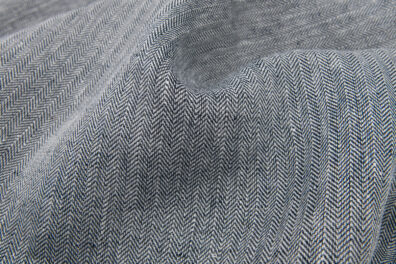 Lniana tkanina czarno-biały splot jodełkowy.