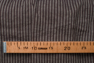 Tkanina lniano - wełniana w brązowe i szare paski.