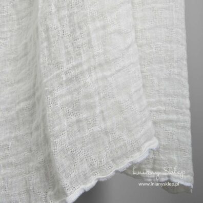 Lniana prana prześwitująca żółtawa w romby tkanina.