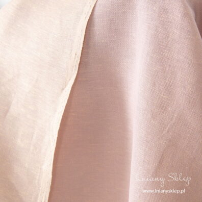 Dwustronna żółto – liliowa tkanina wytkana lekko wypukłym wzorkiem.