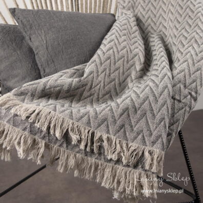 Lniany pled w piaskowo-szary wzór.