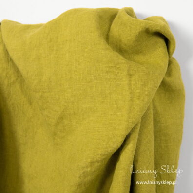 Żółta o zielonym odcieniu dekatyzowana (prana) tkanina lniana.