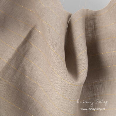 Szara tkanina lniana w złote paski.