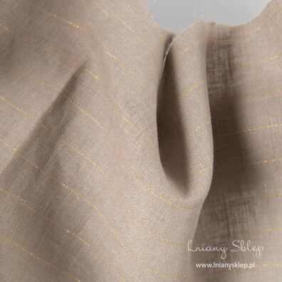 Szara tkanina lniana w złote paski.